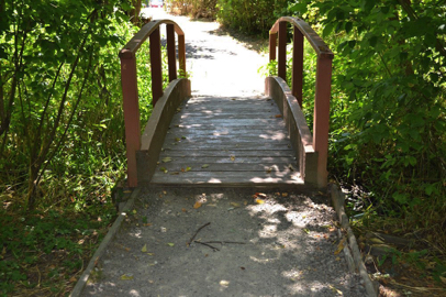 The wooden bridge may have a lip of greater than 2” – transition to compacted rock